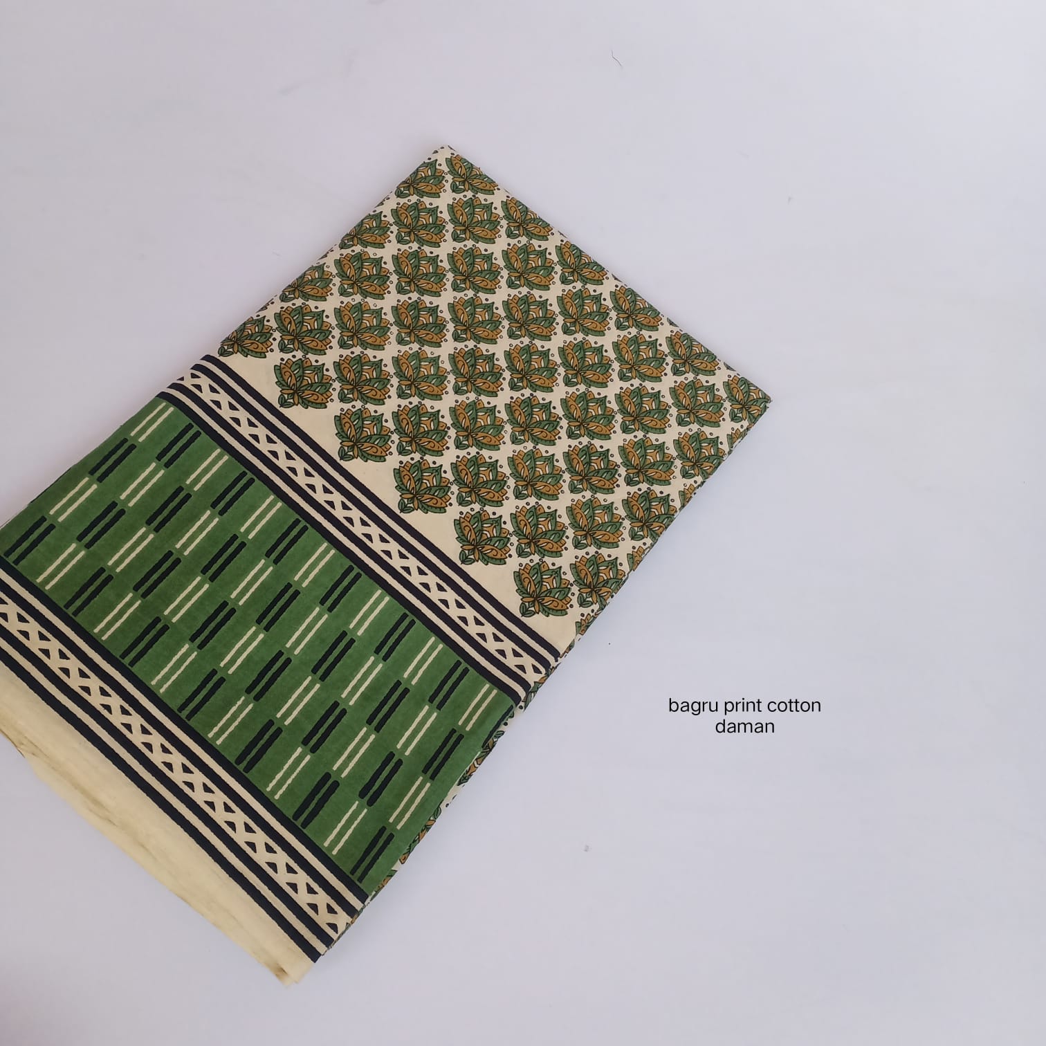 Green Bagru handblock printed cotton fabric with daman border floral pattern, premium wholesale fabric from Fabtexs